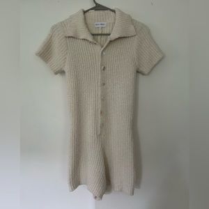 Luca and Grae white fuzzy romper.